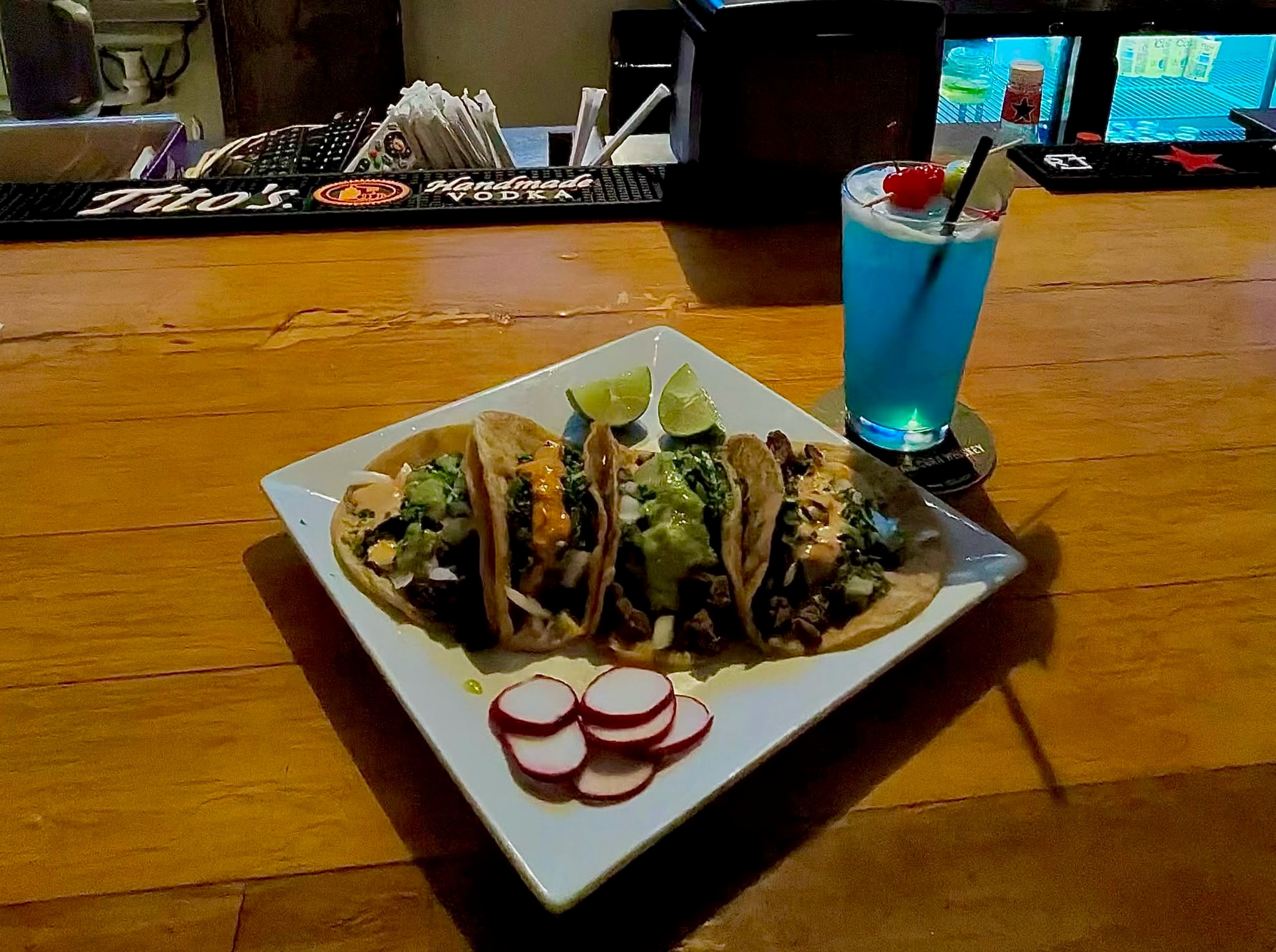 Street tacos with blue cocktail at Westrail bar